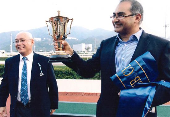 Giresh Melwani collecting the trophy for the Chinese Club Challenge Cup 2012